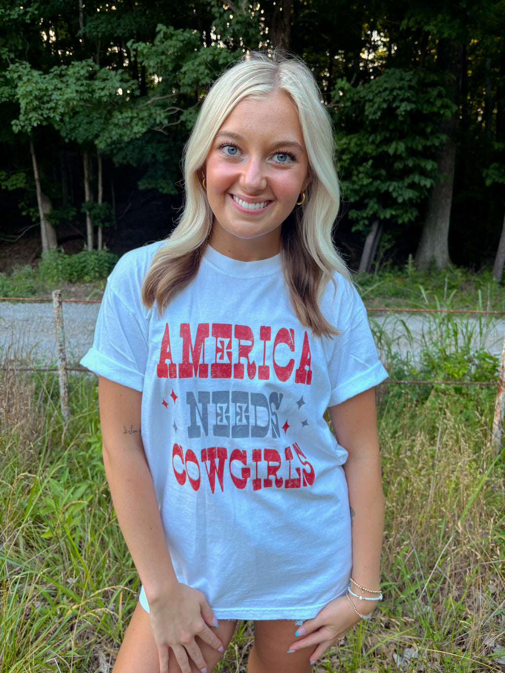 America Needs Cowgirls Tee